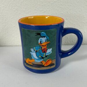 The Disney Store Donald Duck Coffee Mug Tea Cup Blue Orange Yellow